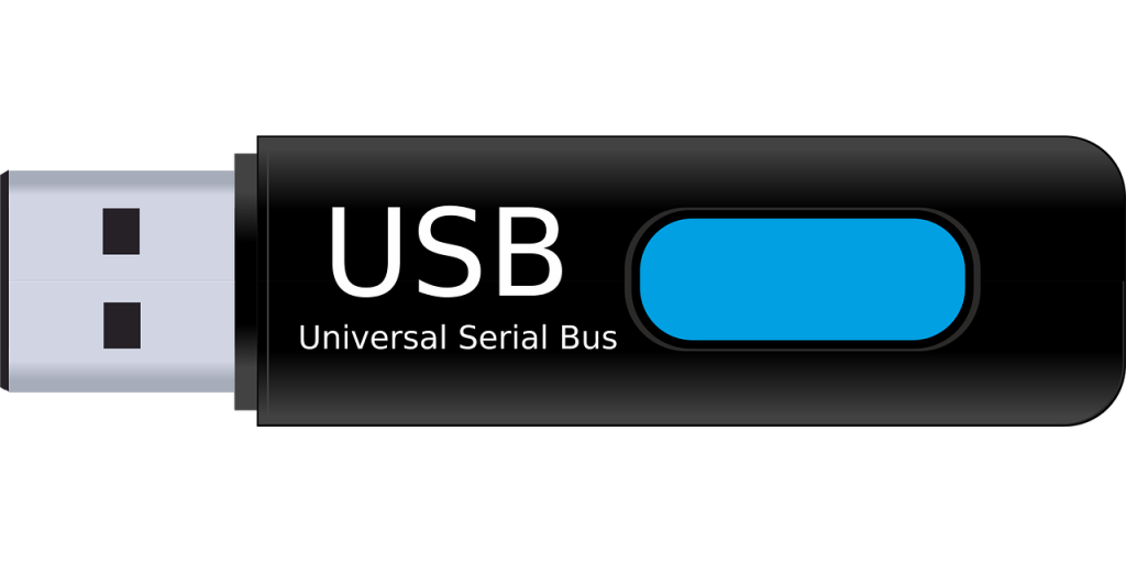 Illustration of a USB flash drive labeled Universal Serial Bus on a black background.