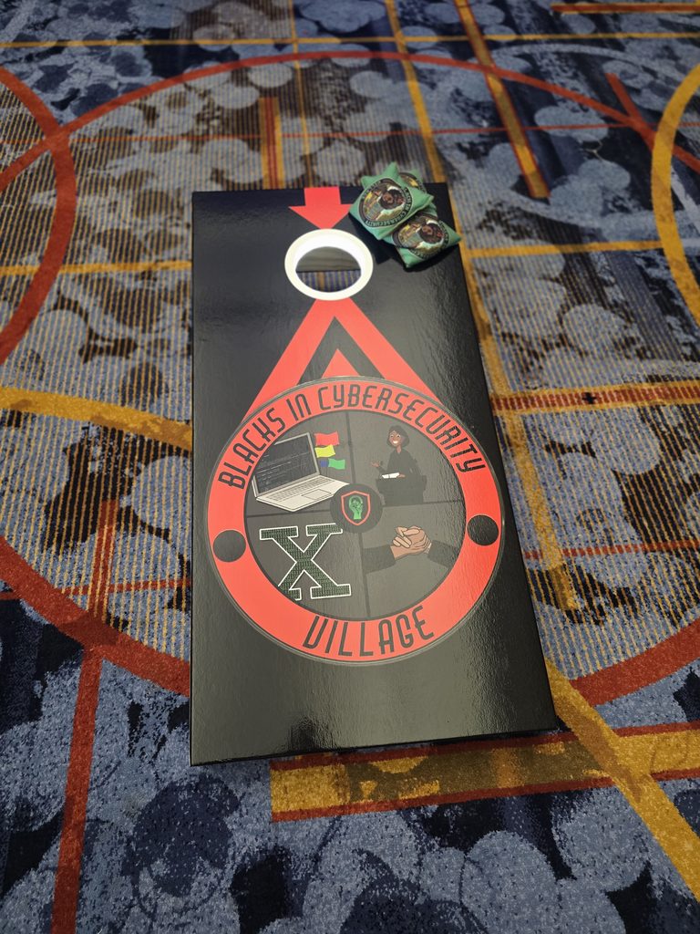 Blacks in Cybersecurity Village custom cornhole board and beanbags.